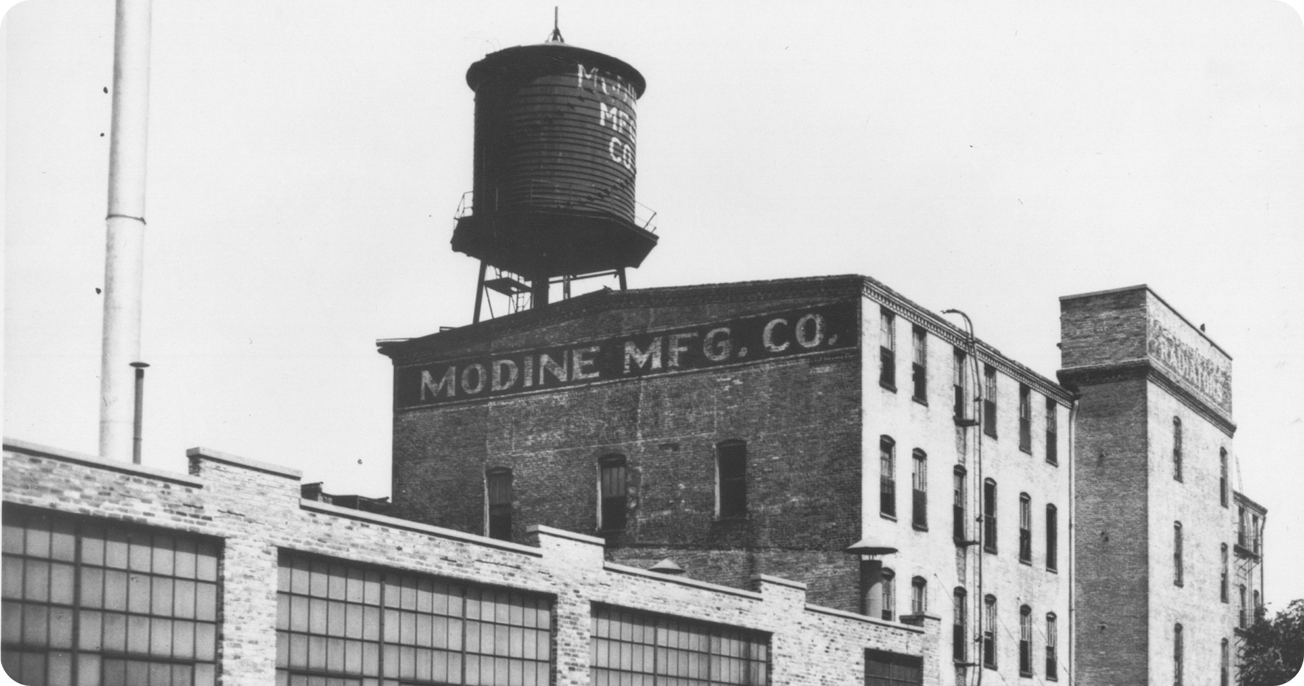 Historic photo of the Modine Manufacturing Co. building and water tower in Racine, Wisconsin